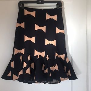 Midnight blue flounce skirt with pink bow pattern